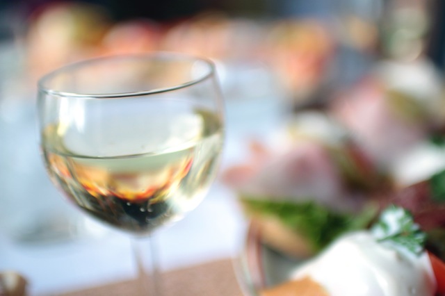 a blur image of a glass of wine