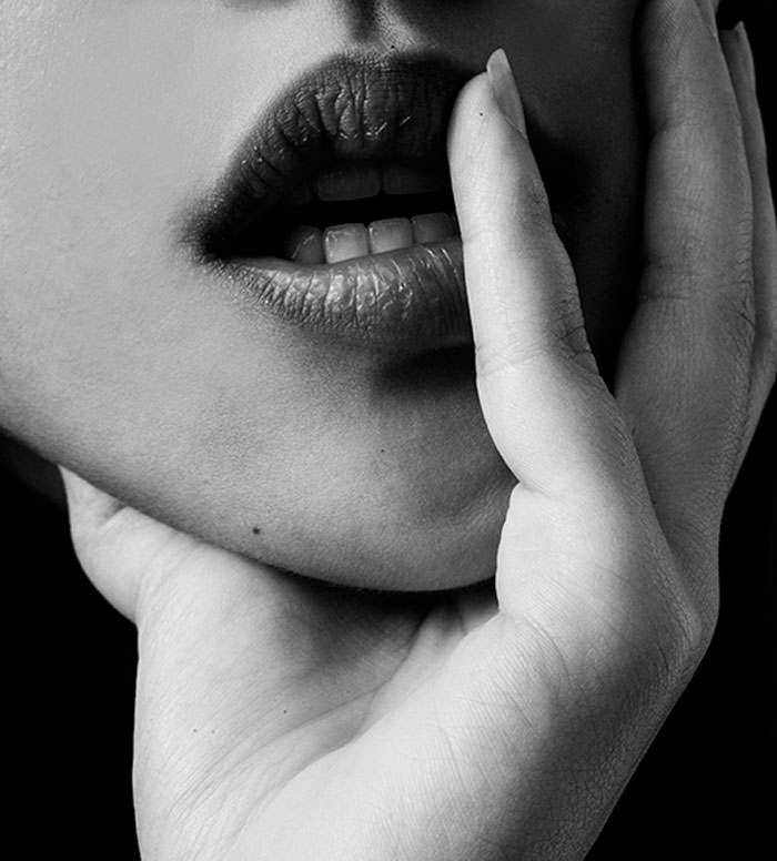 A black and white image of a woman's lips