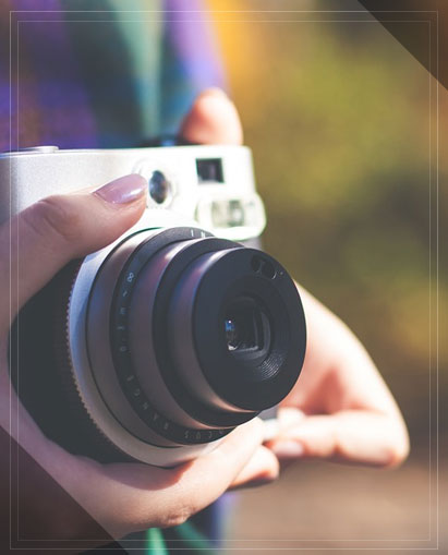 image of a hand holding a camera