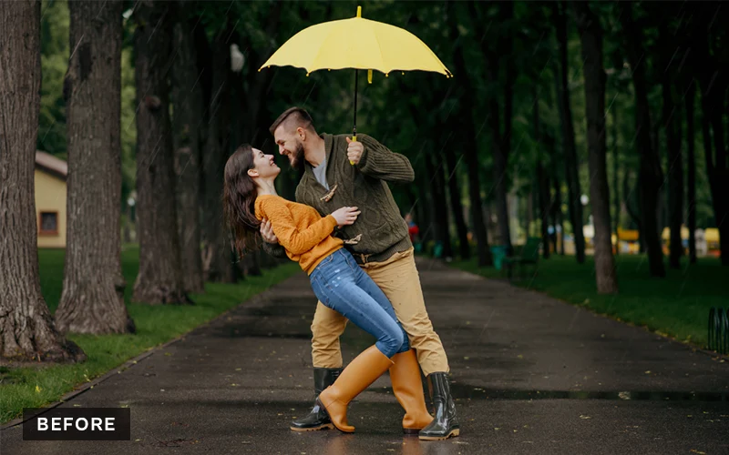 couple posing with an umbrella