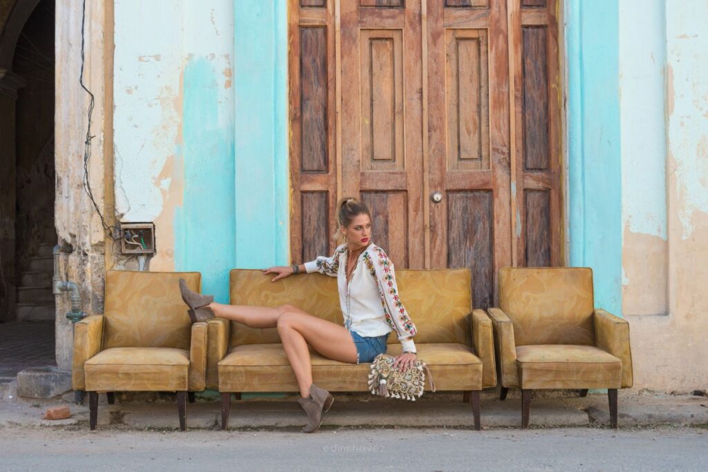 image of a lady posing on a rustic sofa