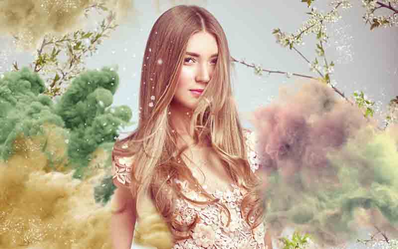 beautiful model portrait with many colored romantic clouds overlay