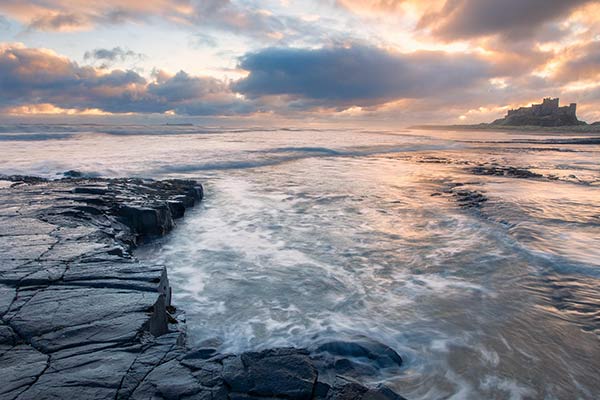 An image of scenic beauty of a shore against the sky with different shades