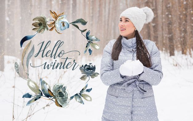 model wearing warm clothes on a snowy day with hello winter text