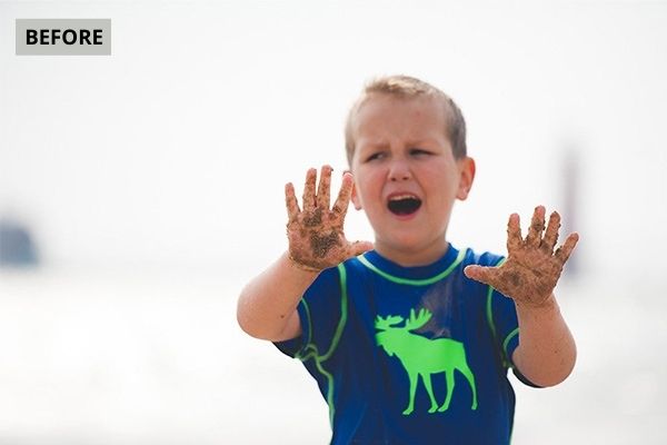 boy playing in sand