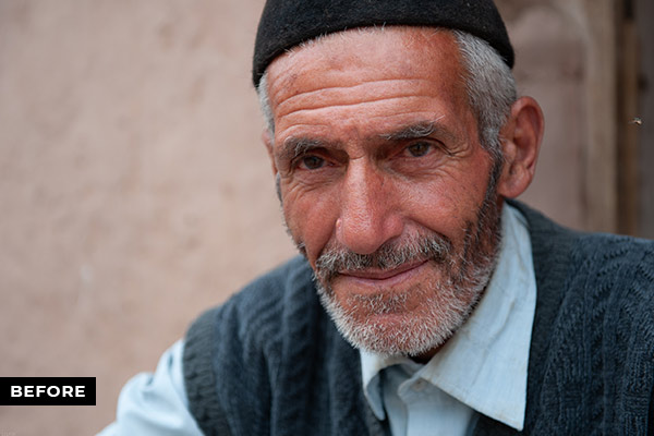 A portrait image of an old man before editting