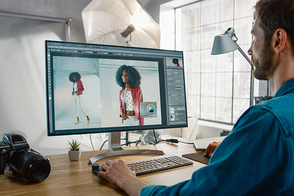 Photographer editing in Photoshop