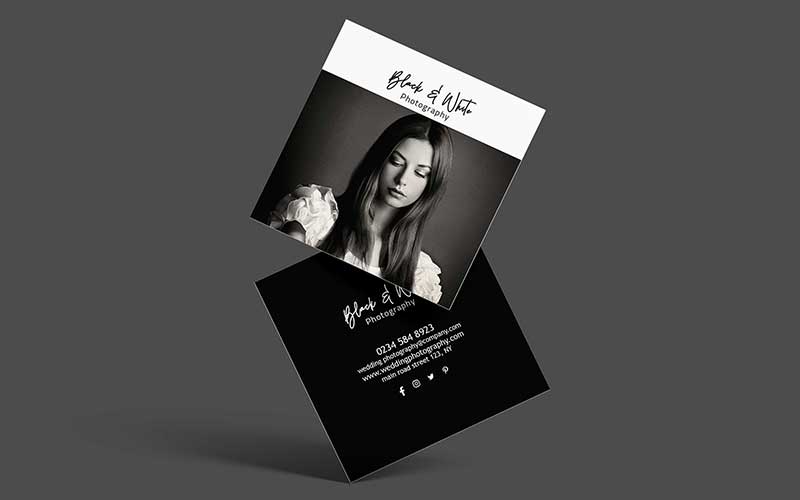 A square business card with black and white theme