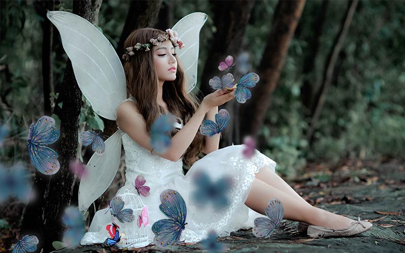 Butterfly overlays added on a girls photo