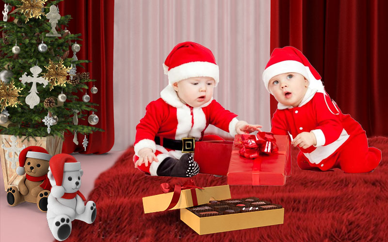 Two kids with gifts being dressed as Santa