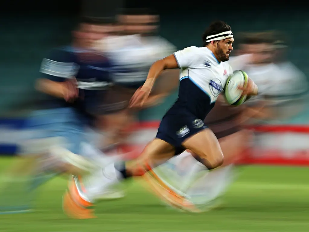 motion blur image of some rugby players