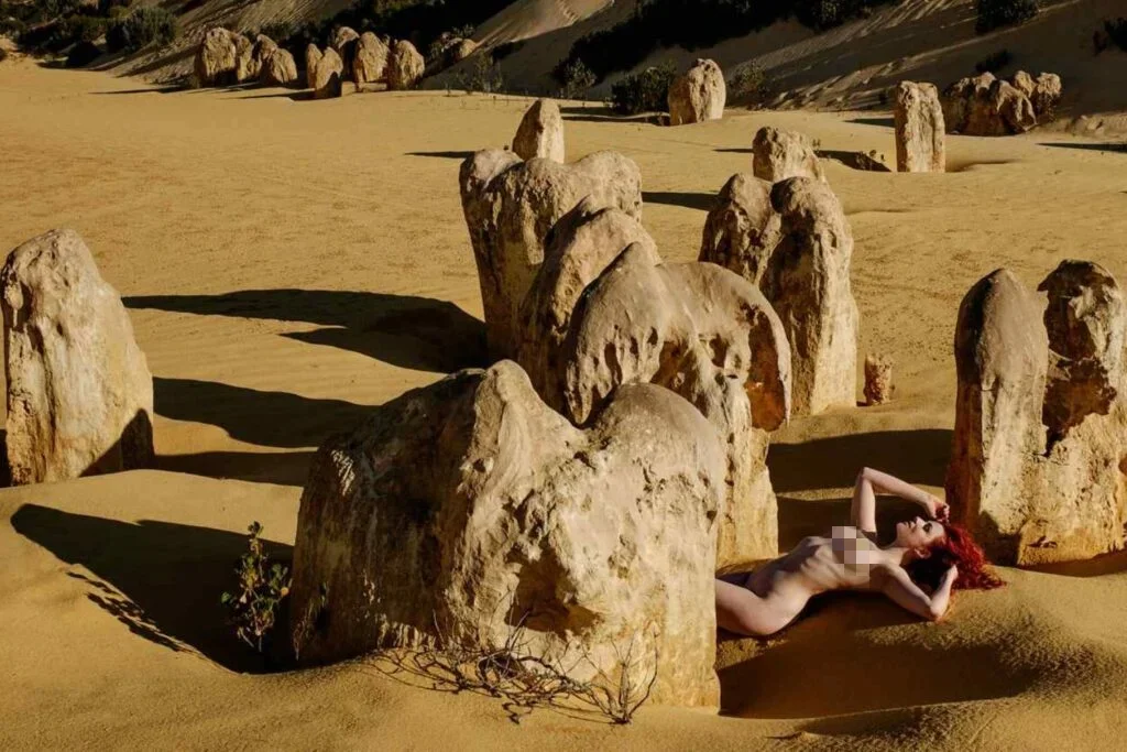 nude pose in desert island