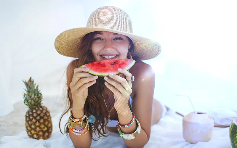 pretty woman eating a watermelon