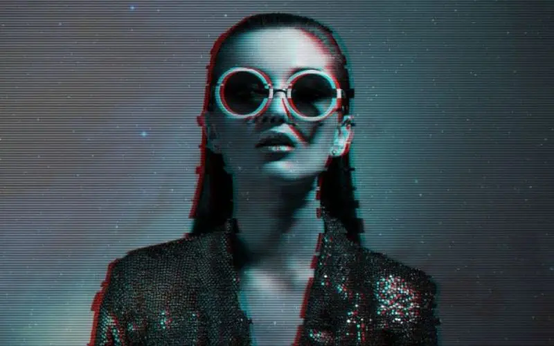 featured glitch effect image of a girl wearing round glasses