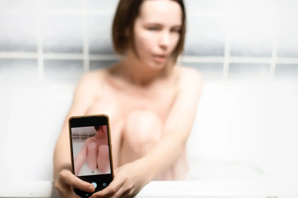 Women taking a selfie in bathtub