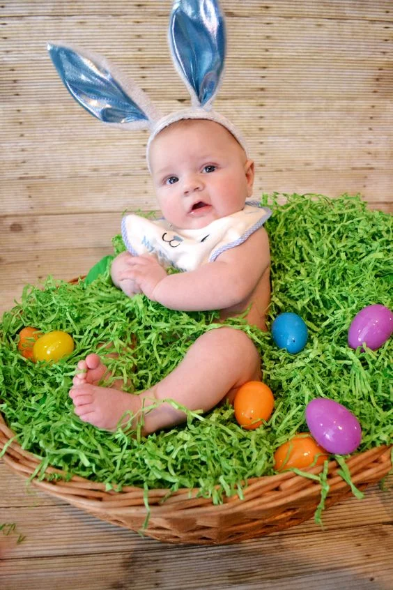 baby in a egg basket