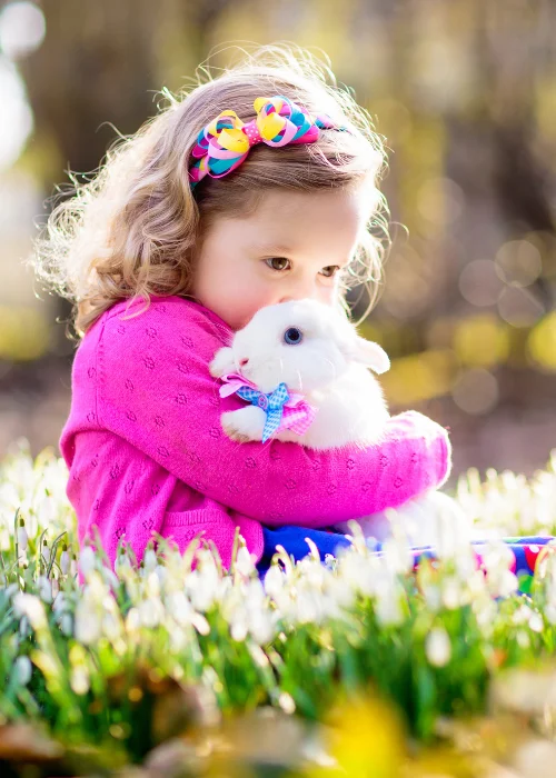 girl holding a easter bunny