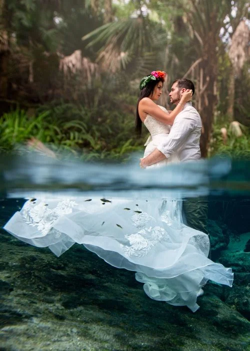 underwater shot of a bride and groom