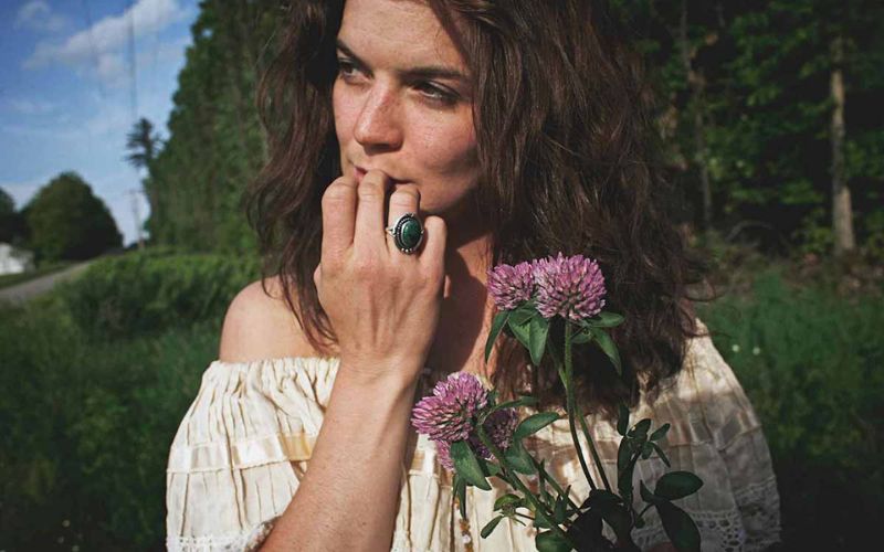 A girl holding beautiful flowers captured