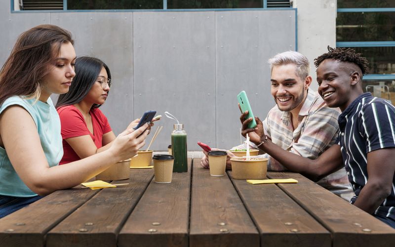 group-of-friends-using-smart-phone