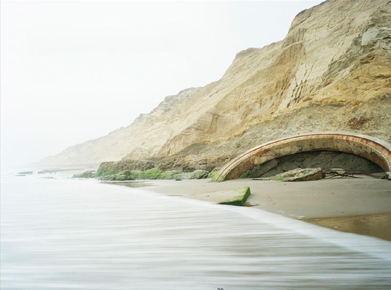 a picture of mountains beside the sea