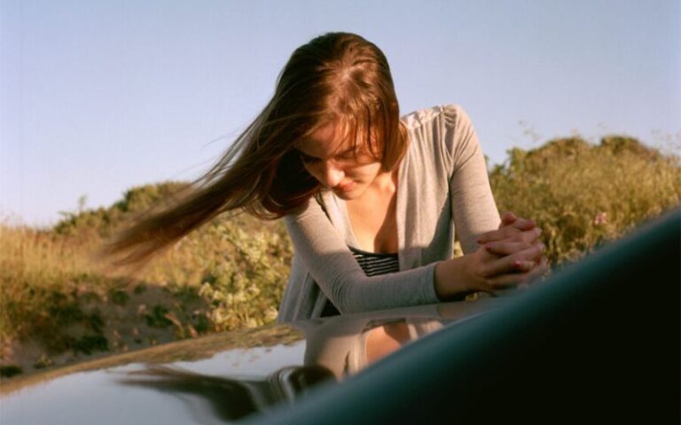 Girls image near a car