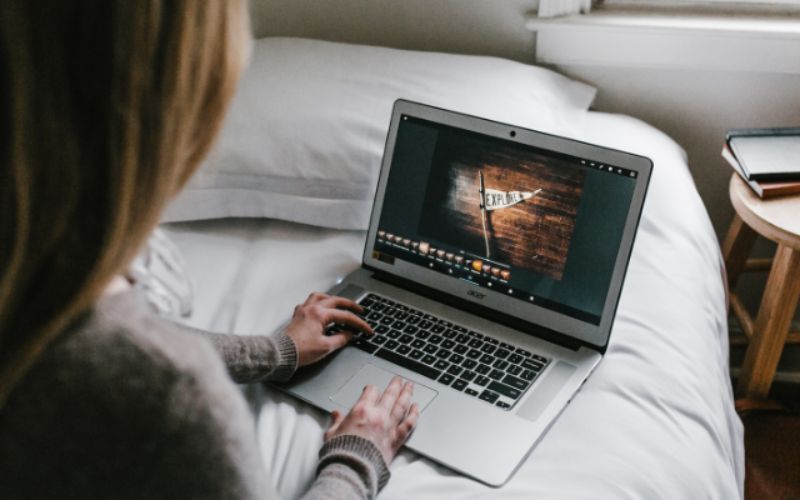 A woman using laptop image