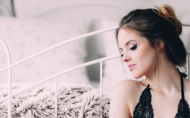 an image of a woman posing and looking sideways