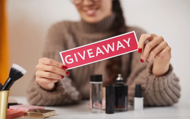 women holding giveaway sign