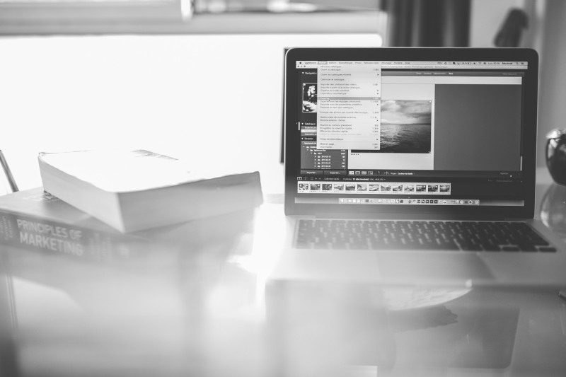 A b&w image of a MacBook