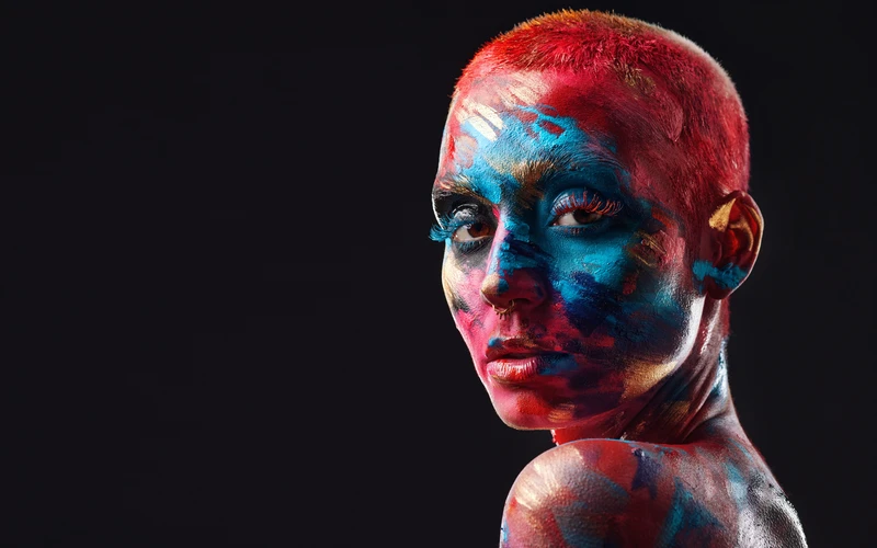 Close-up portrait with painted face and body art, an expressive style of figure photography