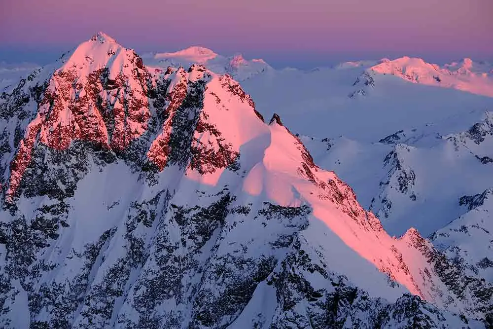sunset on the snow clad mountains