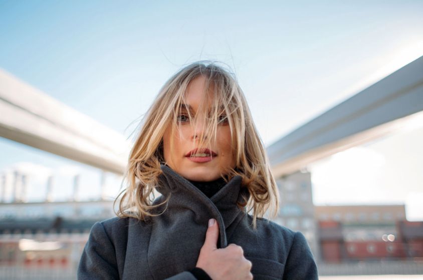 portrait of a woman wearing a dark green sweater