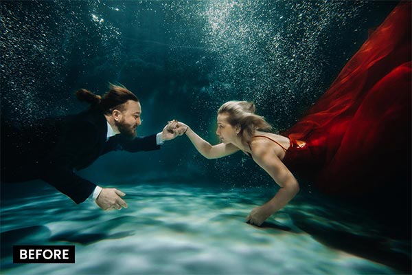 couple posing underwater