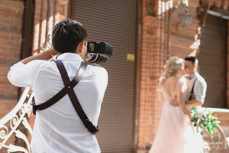 photographer taking picture of a couple