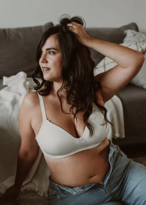 Plus size boudoir photography with relaxed posture and artistic composition