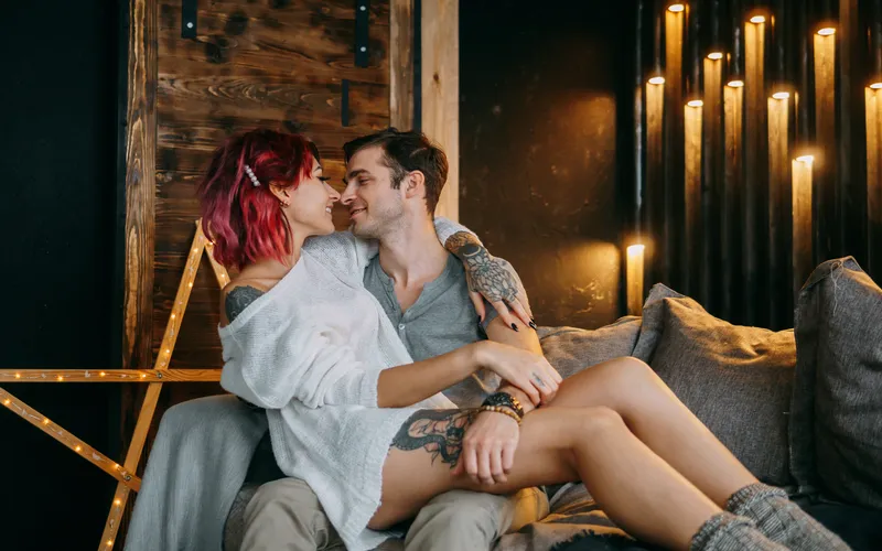 boudoir photography of a couple embracing each other on the couch