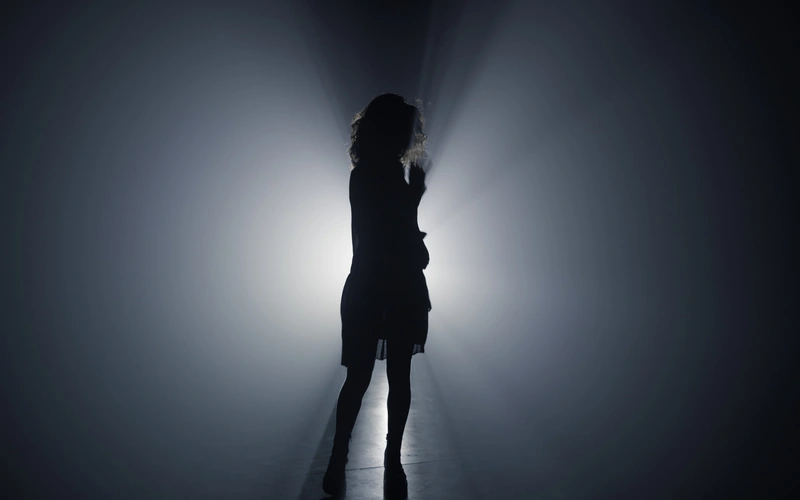 Silhouette of a model backlit for dramatic abstract body photography