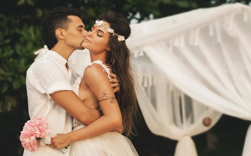 affectionate couple embracing each other while wearing white clothes