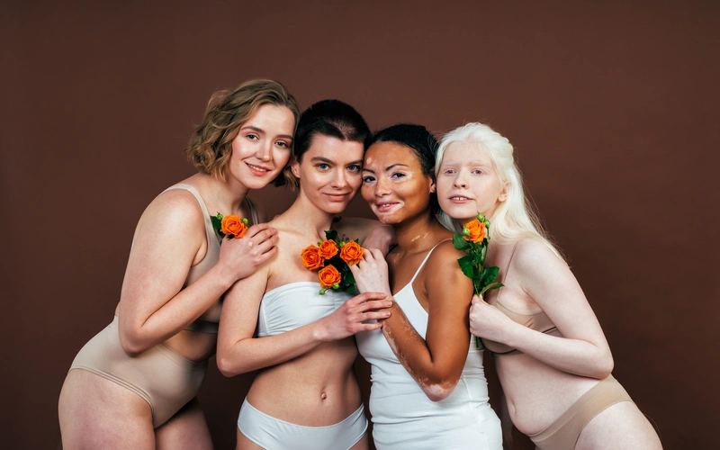 boudoir wedding photography of diverse women holding flowers