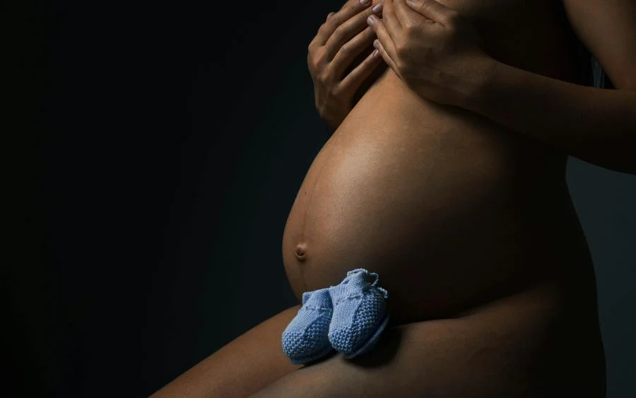 dramatic shot of a pregnant woman