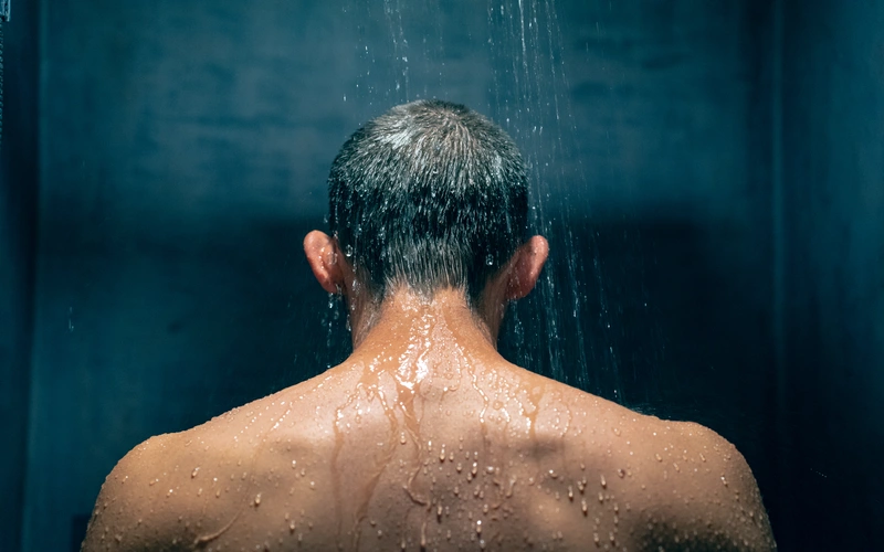 Boudoir photoshoot of a man in the shower