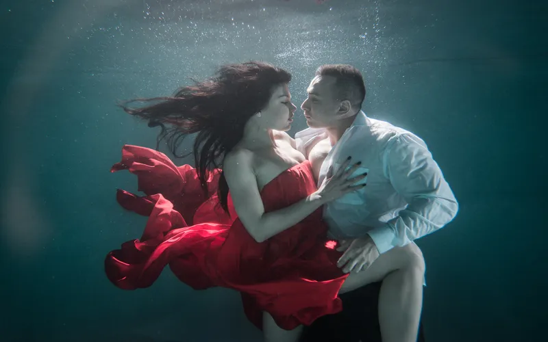 Model striking a ballet-inspired pose for an artistic underwater photoshoot