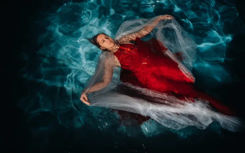 On the back underwater boudoir photography pose