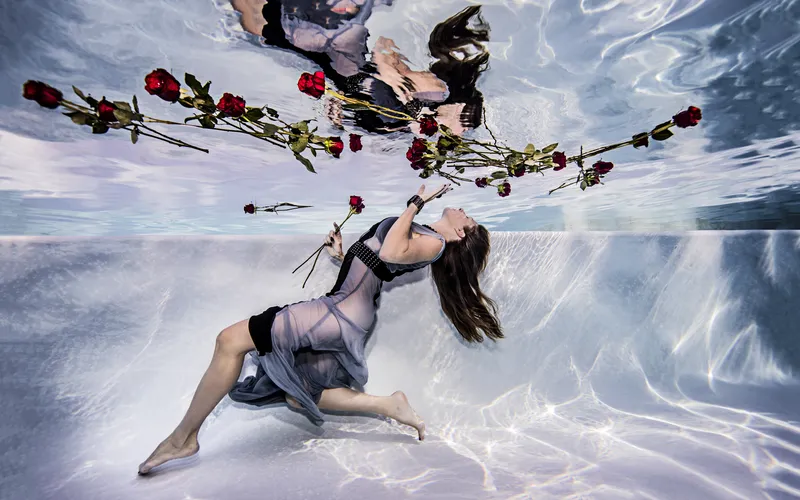Model performing a graceful backbend during an underwater boudoir session