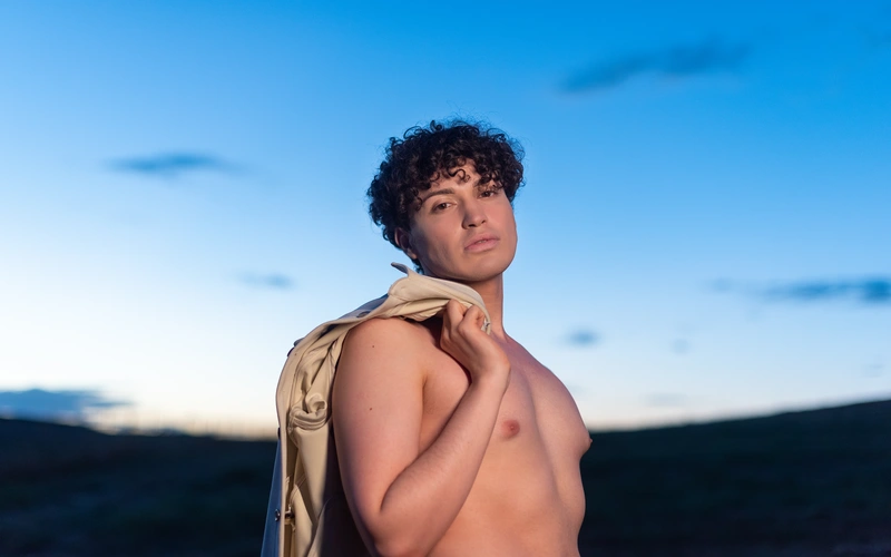Boudoir photography of a man posing in nature