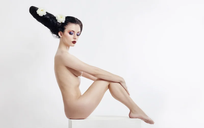 woman sitting near plants