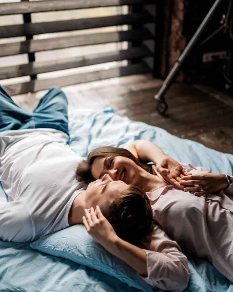 happy couple on bed shoot idea