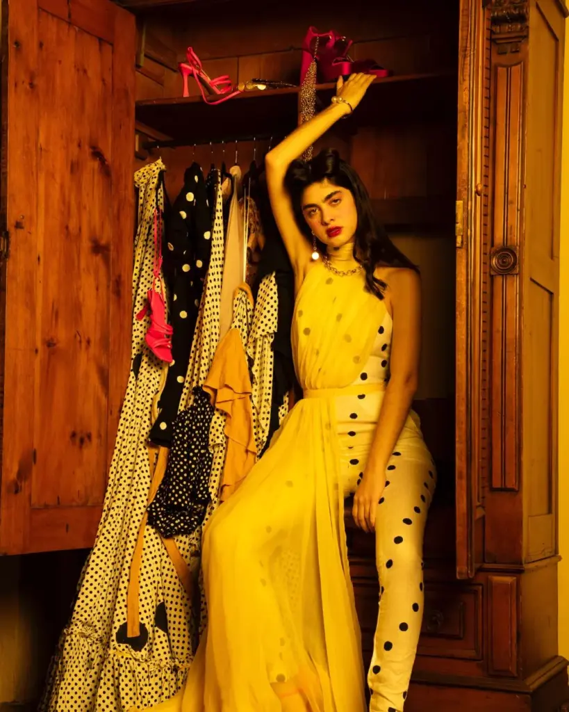 model posing in a closet