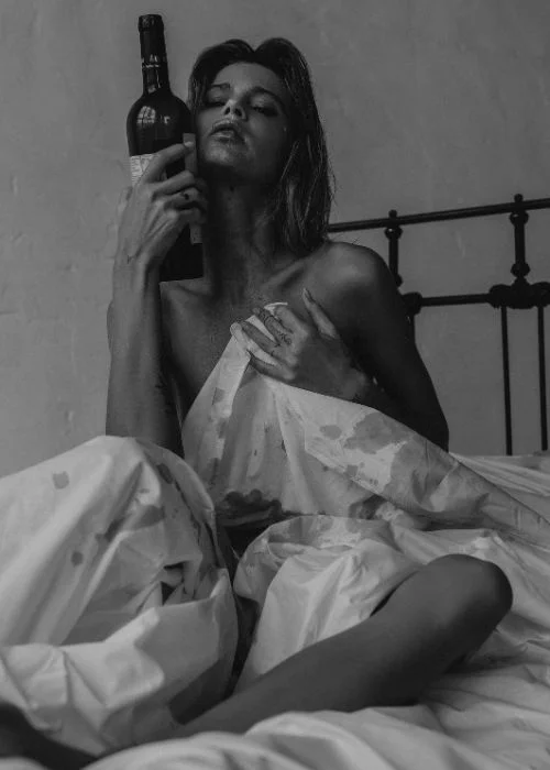 woman holding alcohol